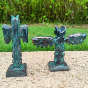 Resin totem figurine detail view, vintage green finish, sand tray game architectural craft decor.