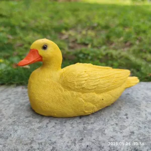 Cute little yellow duck resin figurine, perfect for garden, desktop, and home decor.