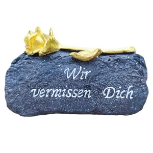 Commemorative grave marker memorial stone with golden rose and condolence text for garden.