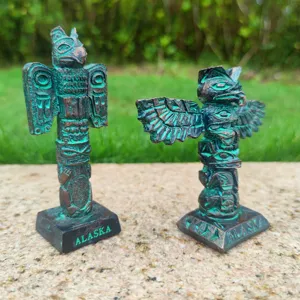 Resin totem pole figurine detail view, antique bronze finish, ideal for tabletop decor.