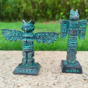 Resin totem model ornament detail shot, showing intricate native style carvings and alaska text base.