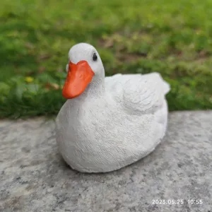 Detailed close-up of the cute white duck resin figurine, perfect for garden and desktop decor.