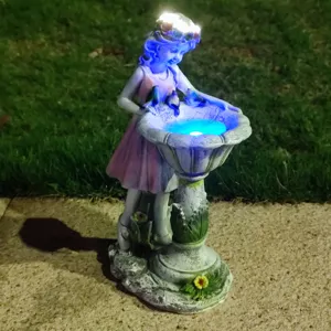 Resin fairy solar garden light detail, glowing birdbath sculpture for outdoor yard lawn decor.
