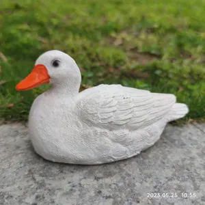 Cute white duck resin figurine garden ornament, perfect for desktop and home decor display.