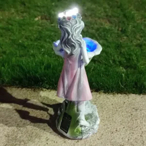 Resin solar fairy garden statue detail, glowing LED light effect for outdoor lawn yard decoration.