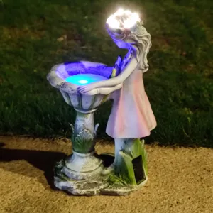 Resin solar fairy garden light statue with birdbath bowl and glowing LED night lights for outdoor yard.