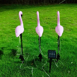Outdoor solar flamingo lawn lights waterproof LED garden stake landscape yard decor set.