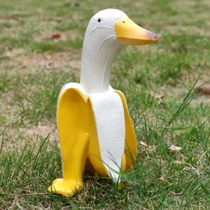 Close-up detail of creative banana duck ornament, cute cartoon animal desktop garden decor.