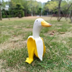 Outdoor close-up of a creative banana duck figurine, perfect for garden and desktop decoration.