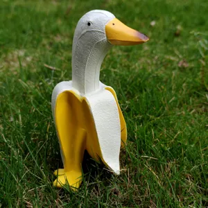 Creative banana duck resin figurine detail, cute animal desktop ornament for garden decor.