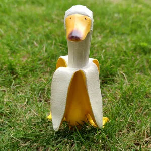 Close-up shot of creative banana duck figurine showing detailed texture and vivid yellow color.