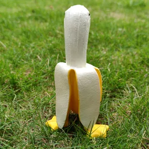 Close-up detail of the creative banana duck figurine showing its unique peel texture and cute feet.
