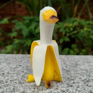 Creative banana duck figurine for home decor, cute cartoon animal desktop ornament gift.
