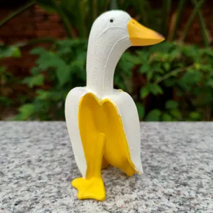 Creative banana duck figurine detail view, cute resin animal sculpture for home desktop decor.