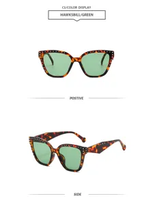 Vista detallada de gafas de sol geométricas carey vintage con lentes de color verde.