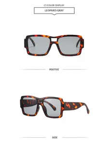 Vue détaillée de lunettes de soleil tendance à double pont, monture léopard et verres gris.