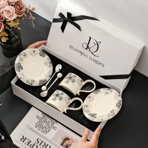 Vintage keramische koffiekop en schotel cadeauset met elegant zwart-wit bloemenontwerp voor thee