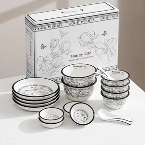 Ceramic tableware set with gift box, including bowls, plates, and spoons for home dining and gifts.