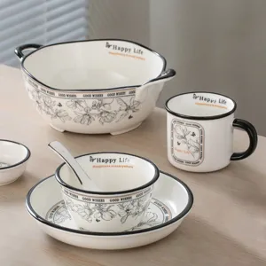 Ceramic tableware set detail, elegant botanical sketch design with black rim, lovely home decor.