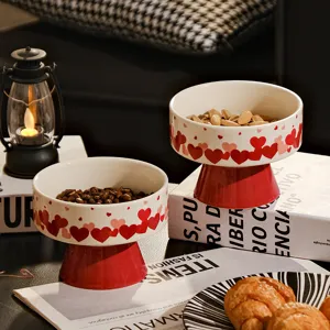 Red heart ceramic pedestal bowl set for snacks, candies, and dried fruit display, home decor.