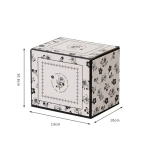 Retro style ceramic mug gift box, elegant black and white floral design for home or office.