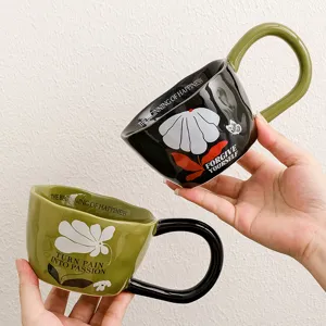 Detail view of creative ceramic coffee mug with unique slogan print and big ear handle.