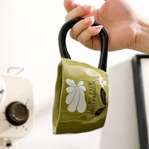 Retro ceramic coffee mug with large black handle and artistic pattern for daily home use.