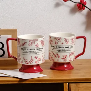 Vintage ceramic coffee mug with high base, red botanical pattern and lovely blessing text details.
