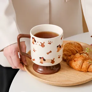 Creative ceramic coffee mug with cute dog pattern and high foot design, detailed scene shot.