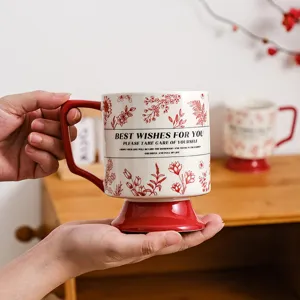 Retro ceramic coffee mug with red floral print and high base, elegant gift for couples.