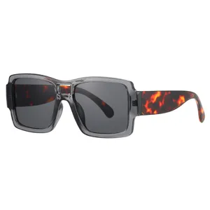 Lunettes de soleil oversize tendance avec monture transparente grise et branches écaille.