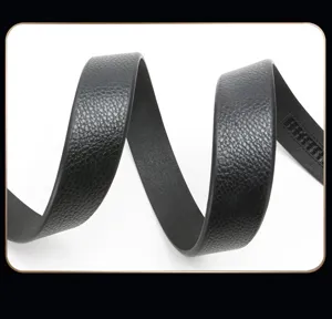 Detailed close-up view of a black leather ratchet belt strap showing texture and track.