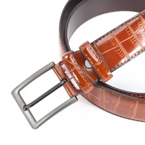 Men's stylish brown crocodile pattern leather belt with classic metal pin buckle.