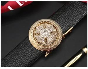 Detailed view of men's automatic buckle belt featuring a luxury gold rhinestone cross metal buckle.