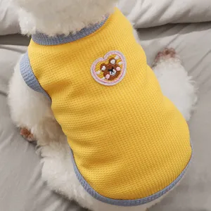 Detail view of a cute yellow pet vest with waffle knit and sweet bear embroidery for dogs.