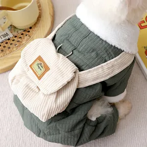 Detail view of warm four-legged pet cotton coat in dark green with cute corduroy small backpack.