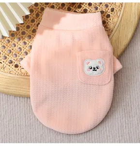 Cute pink fleece puppy vest with pocket and bear patch, cozy winter turtleneck dog sweater detail.