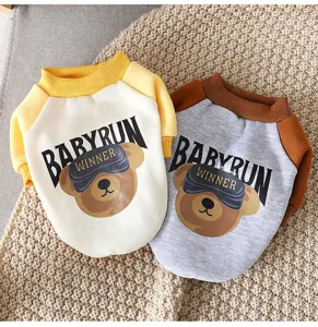 Close-up details of the cute winter pet fleece clothes featuring warm bear print and color block.