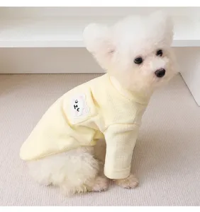Cozy warm yellow high-neck pet fleece vest featuring cute bear pocket for small dogs.