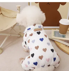 Detailed view of cozy thick pet four-leg warm winter jumpsuit with cute colorful heart prints.
