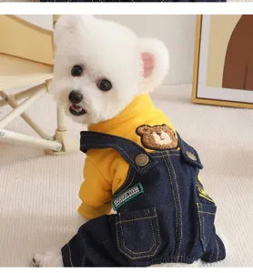 Detailed view of the cute pet autumn winter dog clothes set with yellow sweatshirt and denim overalls.