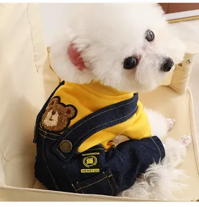 Cute winter pet dog clothes set detail shot, yellow sweatshirt and denim overalls for small dogs.