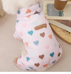 Detailed view of cute pink dog winter warm jumpsuit with colorful heart print for small puppy.