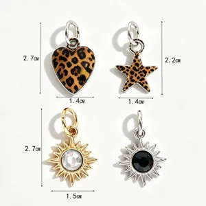 Detailed view of DIY jewelry charms, including leopard heart, star, and crystal sun pendants.
