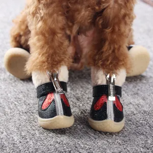 Warm winter pet dog shoes with non-slip soft soles, cute red and black design with zipper.