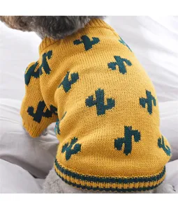 Cute pet dog knit sweater detail view, yellow winter puppy clothes with green cactus pattern.