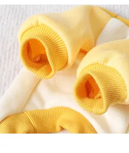 Close-up of warm pet winter fleece clothes, yellow white color-block ribbed cuffs detail.