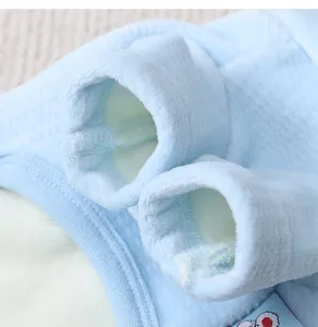 Close-up detail of soft blue fleece puppy winter clothes cuff, showing warm cozy fabric texture.
