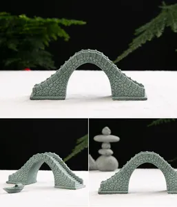 Detailed view of miniature resin stone bridge for fish tank landscaping and micro decor.