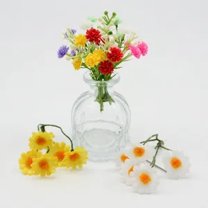 Artificial daisy flower bouquets with glass vase for DIY home decoration and craft supplies.
